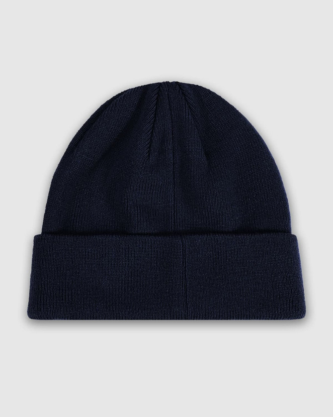 A navy blue watch cap featuring a cuffed design and a smooth knit texture. The cap includes branding.
