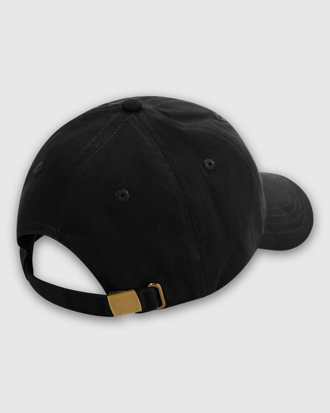 A black dad cap featuring a gold metal buckle at the back and ventilation eyelets.