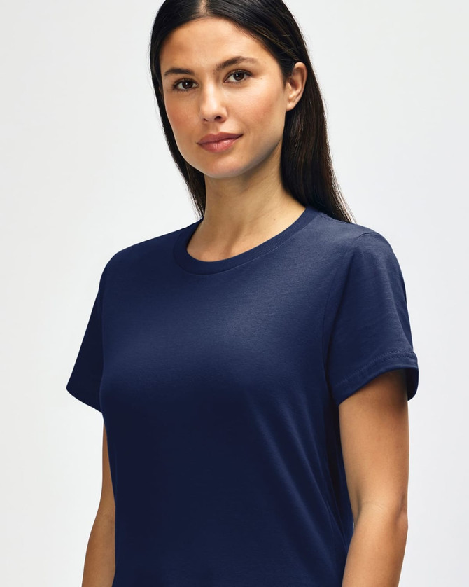 A close-up of a navy blue Gildan Softstyle ladies midweight T-shirt featuring a round neckline and short sleeves.