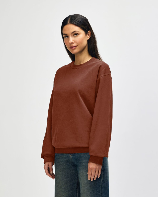 A brown Gildan Softstyle adult sweatshirt with a classic fit and long sleeves, featuring a logo.