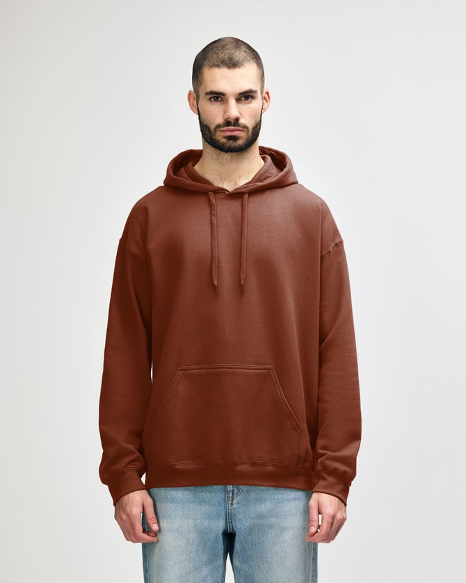 A brown Gildan Softstyle adult hooded sweatshirt worn by a woman, featuring a front pocket and drawstring hood.