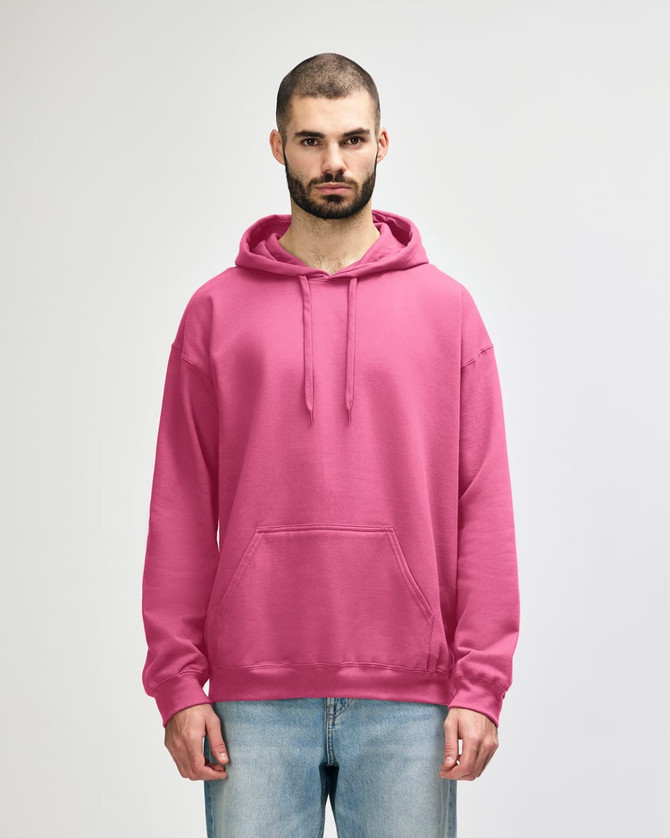 A pink hooded sweatshirt with a front pocket and drawstring hood, worn by a model. Features a branding logo.