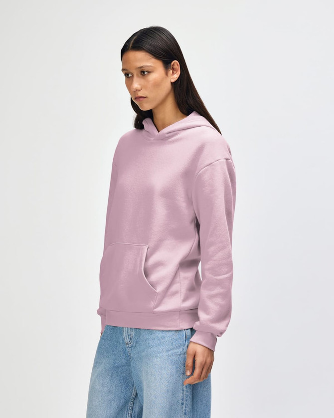 A unisex hooded sweatshirt in a soft pink colour, featuring a front pocket and a hood. It has a logo.