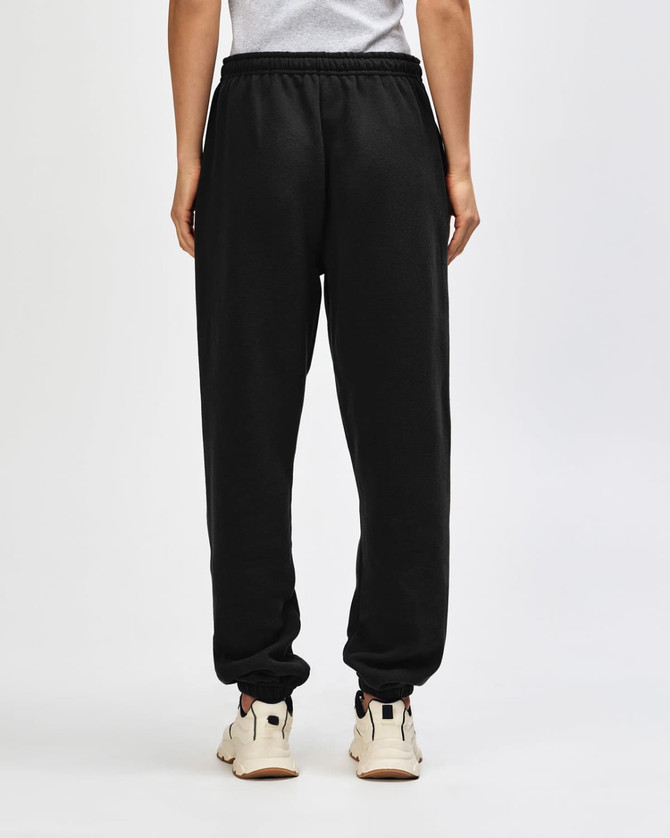Unisex sweatpants in black with an elastic waistband and tapered cuffs, featuring a logo on the back.