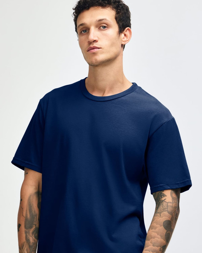 A navy blue unisex short sleeve T-shirt with a relaxed fit, featuring a logo on the side.