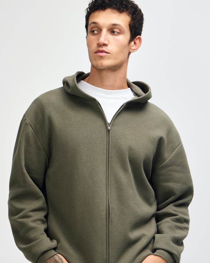 A unisex full zip hooded sweatshirt in olive green, featuring a relaxed fit and a hood. Includes a logo.