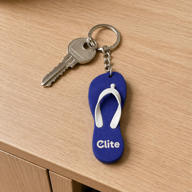 A blue and white thongs-shaped EVA keychain with a metal key attached, featuring a logo.