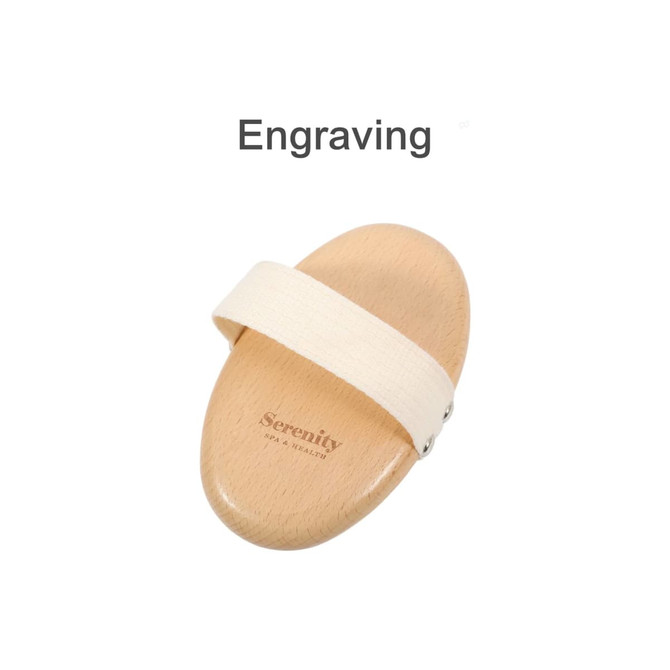 A wooden brush with a light wooden body and a cream strap, featuring a logo engraving.
