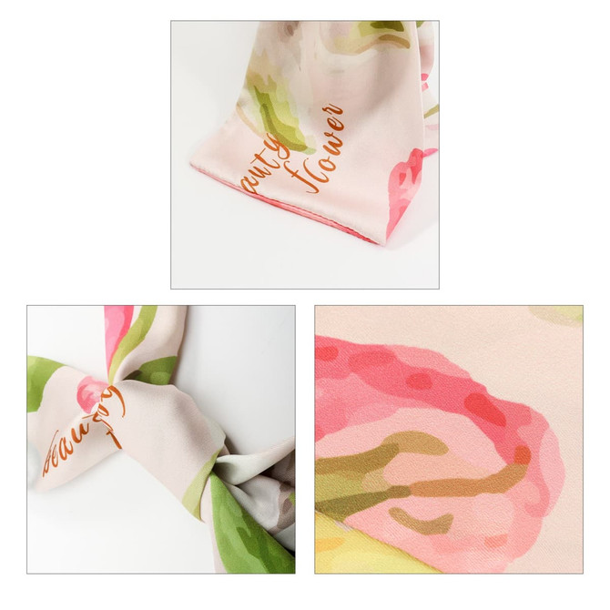 A Twill Weave Long Scarf featuring floral patterns in pink and green hues, with a subtle logo visible.