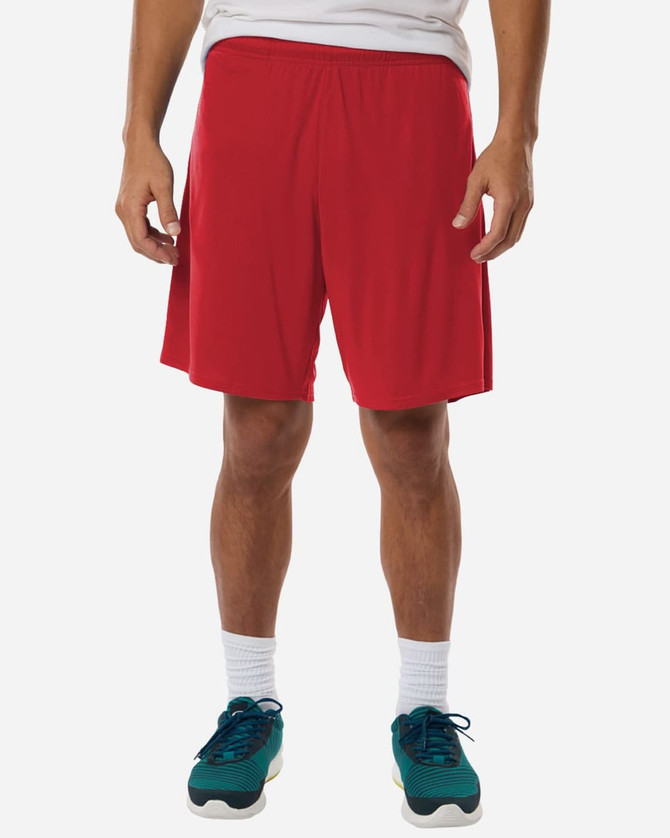 A pair of red men's shorts with an elastic waistband, paired with teal sports shoes.
