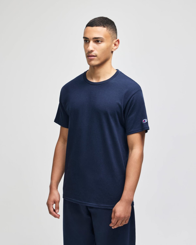 A navy short sleeve t-shirt with a crew neck and a logo on the sleeve.