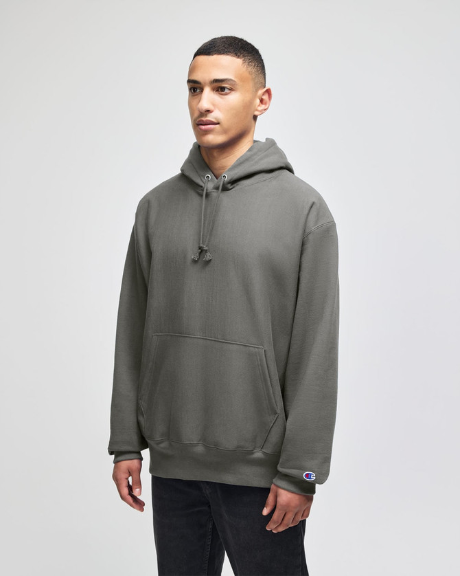 A grey adult pullover hooded sweatshirt with a front pocket and a small logo on the sleeve.