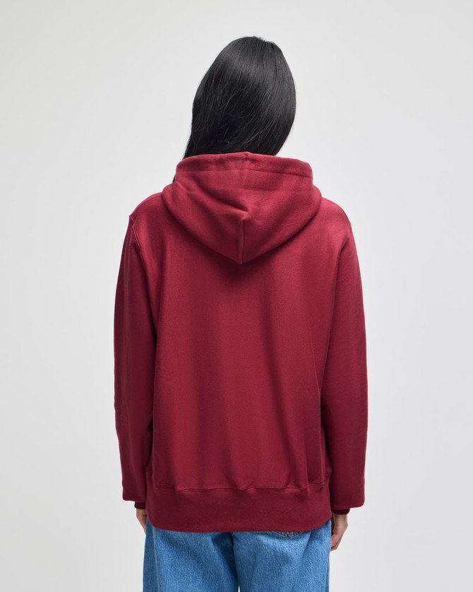 A red pullover hooded sweatshirt with a back view, featuring a hood and relaxed fit.