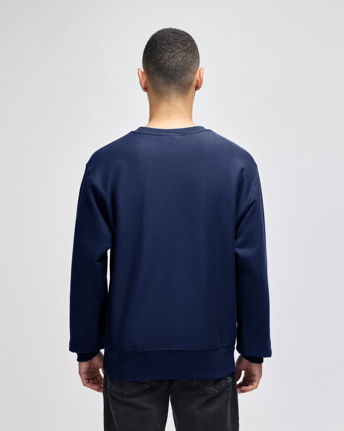 A navy blue adult crew sweatshirt with a relaxed fit, featuring a logo on the back.