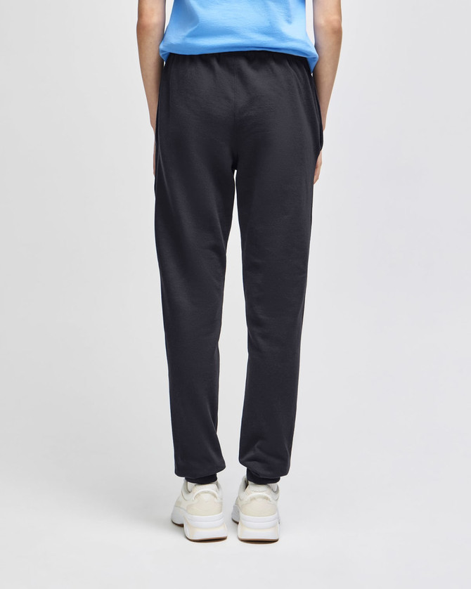 Adult fleece joggers in dark grey, featuring an elastic waistband and a logo. Model shown from the back.