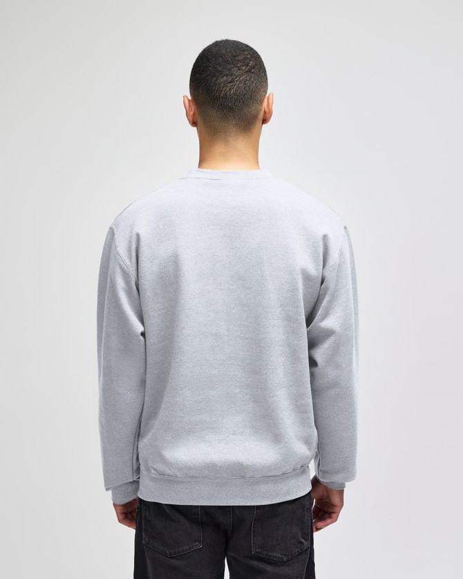 A grey adult crewneck sweatshirt featuring a logo on the back, displayed on a model from the rear.