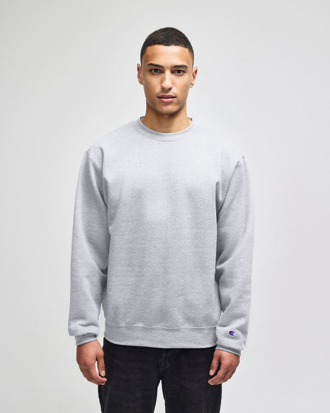 A grey crewneck sweatshirt with a logo, featuring long sleeves and a relaxed fit.