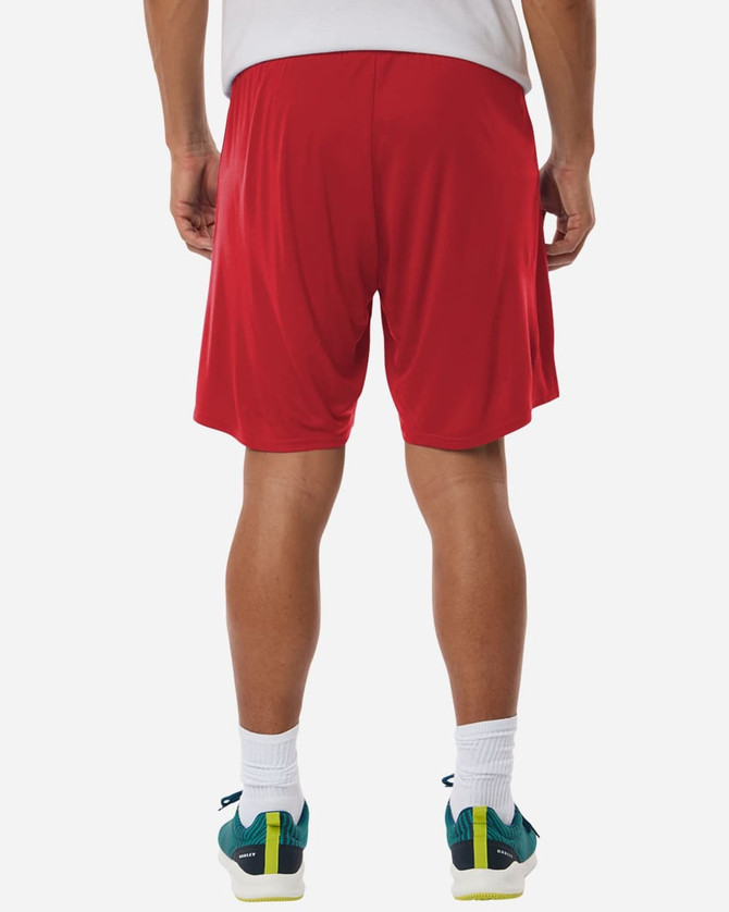 Red men's performance shorts with a loose fit, featuring a logo on the waistband and worn with colourful athletic shoes.