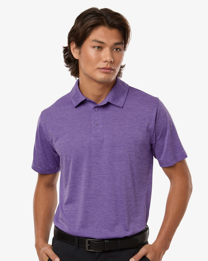 A men's polo shirt in a vibrant purple heather melange, featuring a collar and short sleeves. It has a branding logo.