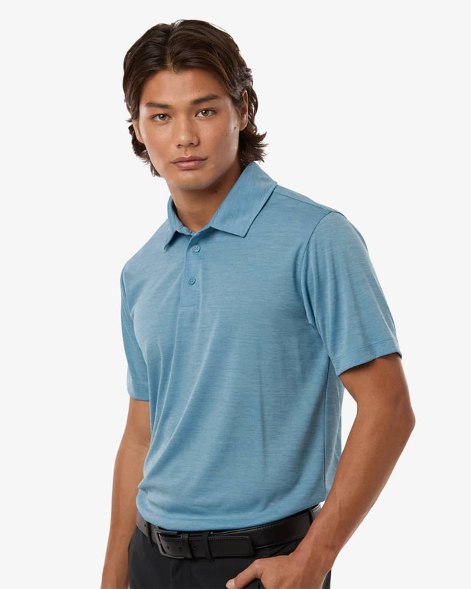A men's polyester heather melange polo in a light blue colour, featuring a collared design and short sleeves.