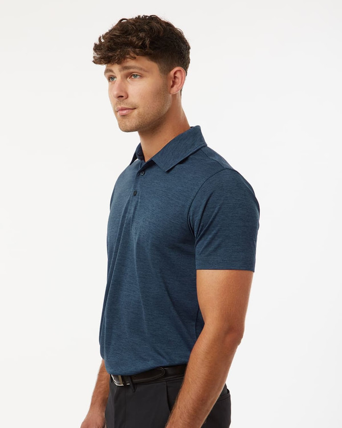 A men's polo shirt in a heather blue melange, featuring a standard collar and a fitted design. It has a logo on the chest.