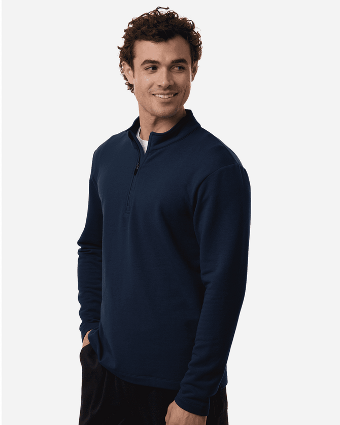 Men's stretch fleece 1/4 zip in navy, featuring a front zip and a comfortable fit, modelled by a man.