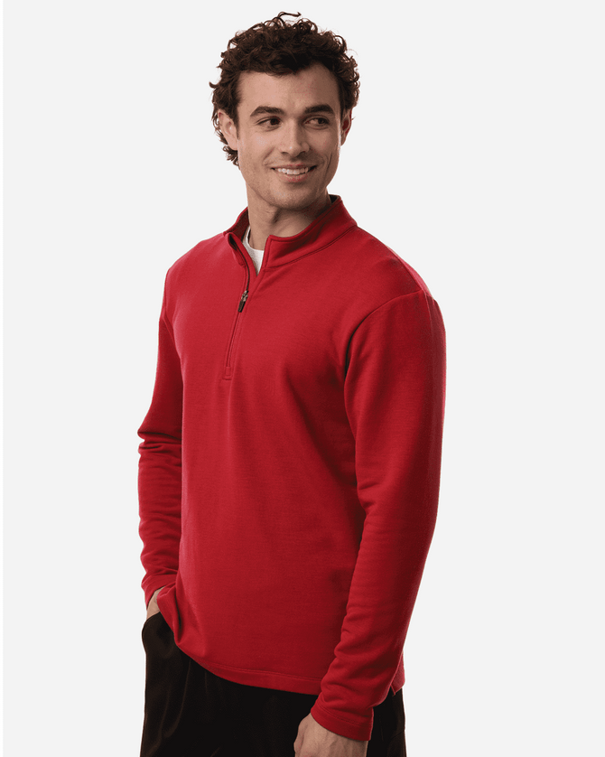 A red men's stretch fleece 1/4 zip top displayed on a model, featuring a collar and long sleeves.