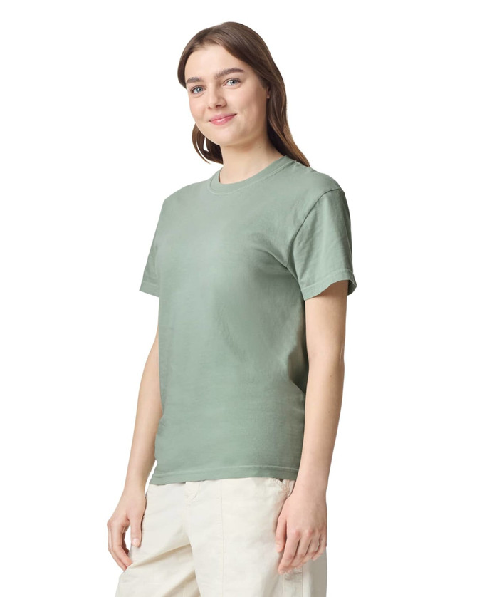 A green heavyweight T-shirt, featuring short sleeves and a crew neck, displayed on a model.