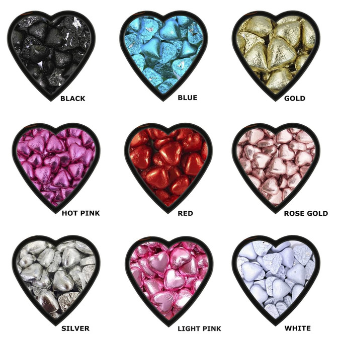 A selection of chocolate hearts in various colours: black, blue, gold, hot pink, red, rose gold, silver, light pink, and white, all in heart-shaped containers.