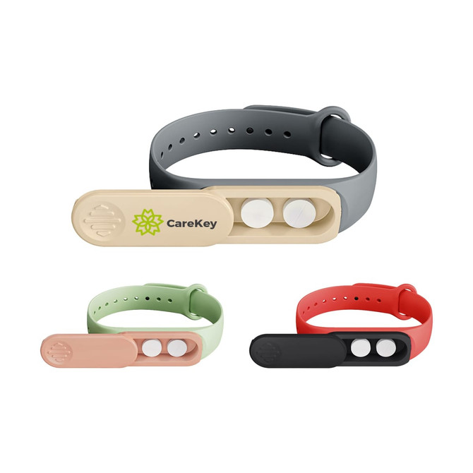 A medicine box wristband with compartments in grey, green, peach, red, and black, featuring a logo.