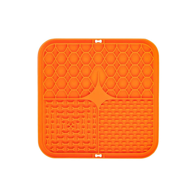 An orange, square silicone lick mat featuring three textured sections: honeycomb, bone shapes, and grid patterns.
