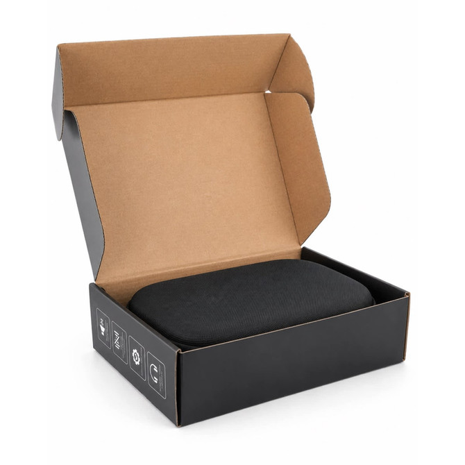 A black headphone case inside an open cardboard box, featuring a simple design with a logo.