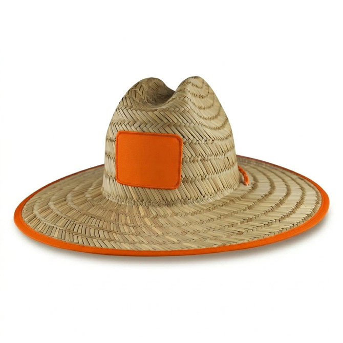 A straw hat featuring a wide brim, a natural weave, and an orange trim with a square logo.