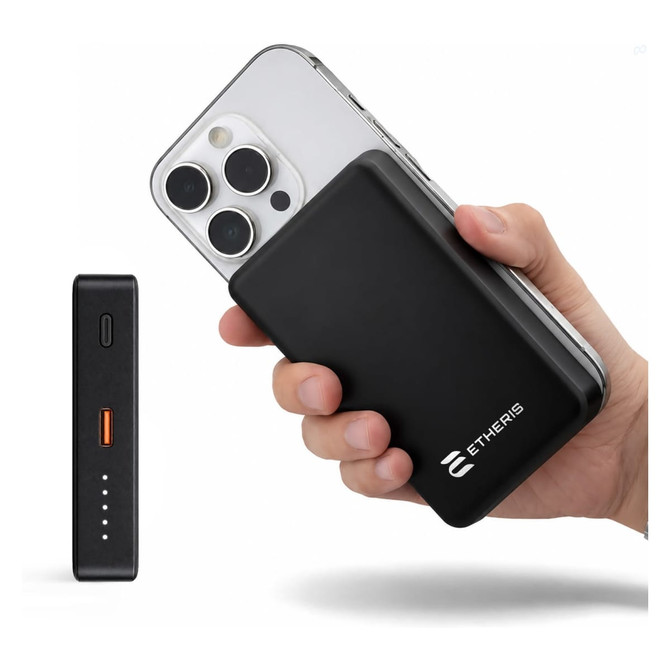 A black solid-state power bank is held next to a smartphone, featuring a small LED indicator and a logo.