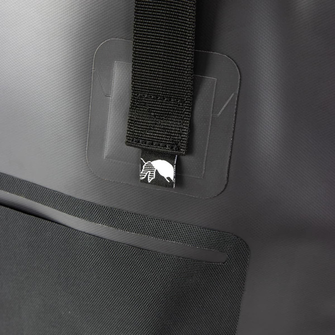 A black bucket bag with a strap and a branded logo on the front. Features a smooth, matte texture.