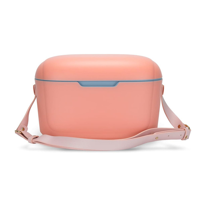 A drink cooler in soft pink with a contrasting blue latch and a detachable light pink strap.