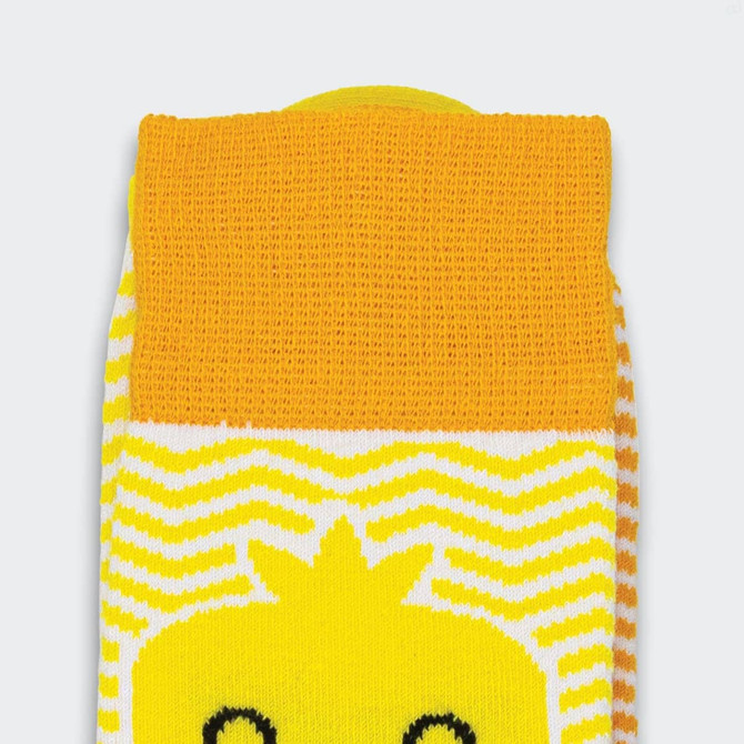 A pair of bright yellow and white knitted socks featuring a playful design and a branded logo.