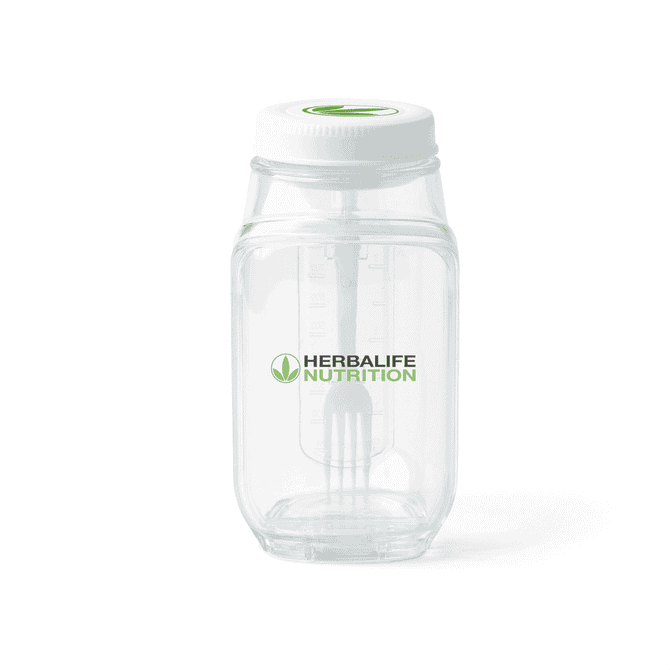 A clear plastic salad jar with a white lid and a branding logo. Features measurement markings on the side.