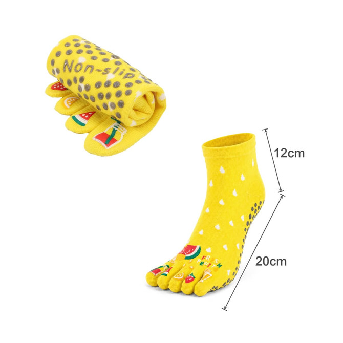 A pair of yellow ankle toe socks with a dotted design, featuring watermelon graphics and rolled up for display.