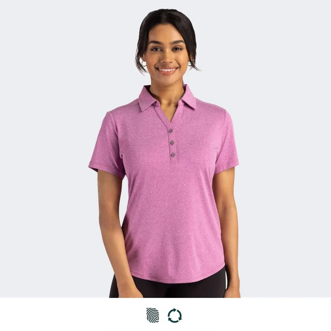 A women's polo in pink with a collared neckline and button detail. Features a logo on the garment.