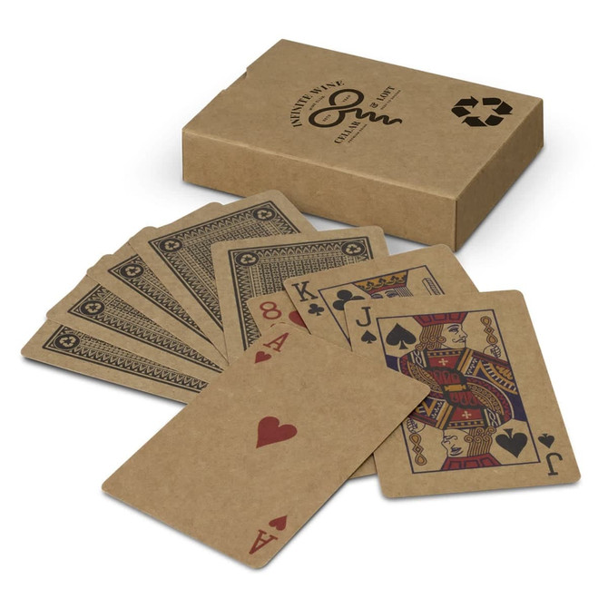 A set of kraft playing cards fanned out beside a kraft box, featuring red and black designs on the cards.