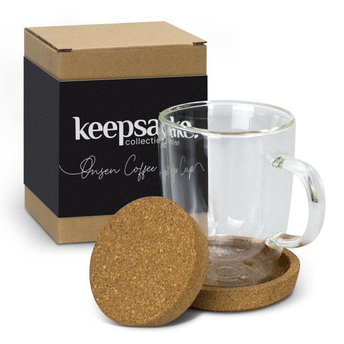 A transparent glass coffee cup with a cork coaster, packaged in a brown box with a branding logo.