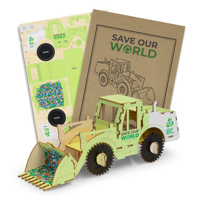 A wooden model of a wheel loader in green, with pieces laid out and a cardboard folder featuring eco-themed graphics.