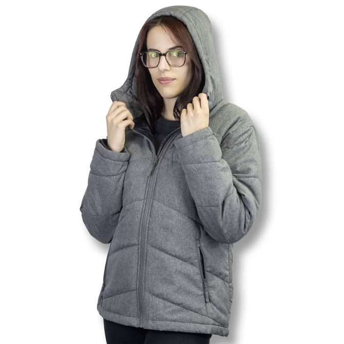 A woman wearing a grey puffer jacket with a hood, featuring a zip closure and side pockets.