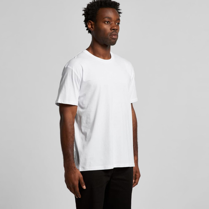 A plain white t-shirt displayed on a model, featuring a casual fit. The shirt has a logo on it.