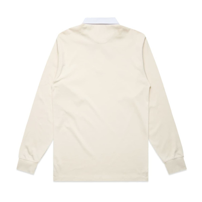 A long-sleeved rugby jersey in cream with a white collar. It features a logo on the front.