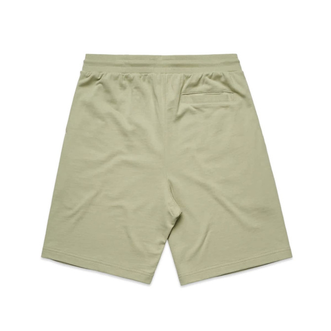 A pair of light green sports shorts with an elastic waistband and a back pocket, featuring a logo.