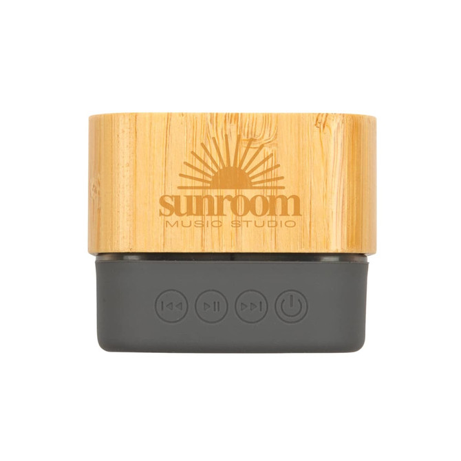 A bamboo Bluetooth speaker with a dark grey base, featuring buttons for playback and a branded logo.