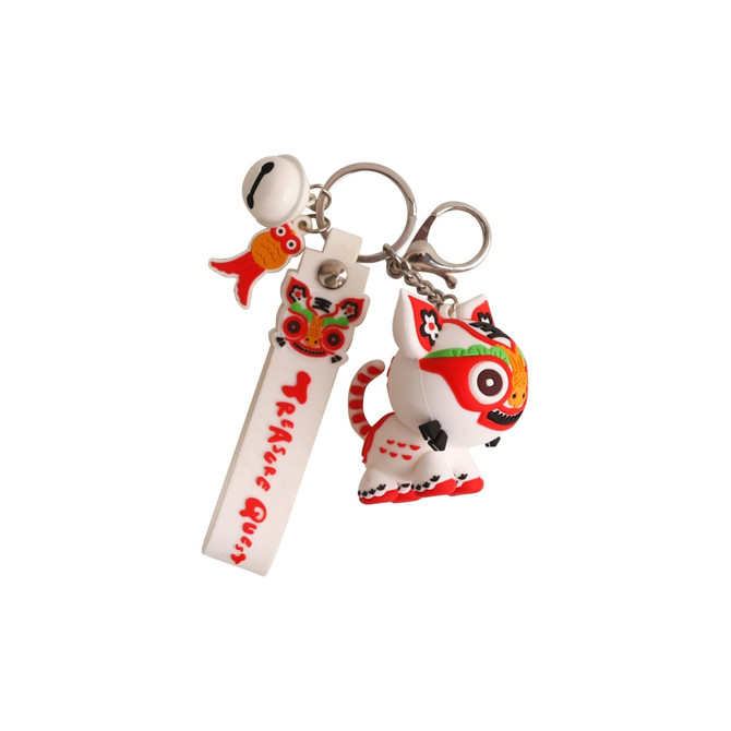 A custom-shaped PVC keyring featuring a colourful lion design with red and white accents, along with a fish charm.