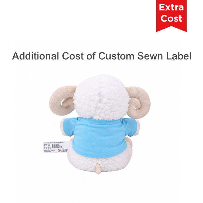 A soft plush toy of a sheep wearing a blue shirt, featuring curly white fur and brown ear details, with a label on the back.